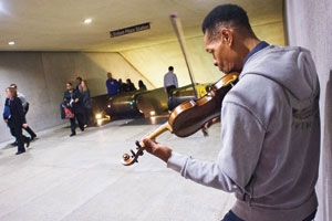 Musician Raycurt Johnson plays for the commuters at D.C.'s Metro station at L'Enfant Plaza. (Photo: Jeff Watts)